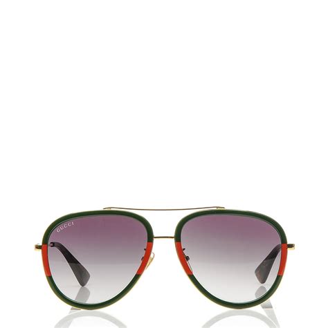 gucci sunglasses with green and red stripe|Gucci aviator style sunglasses.